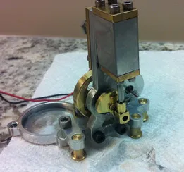 Small double acting steam engine with alternator bracket