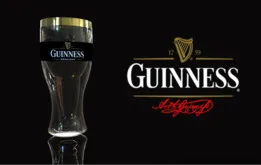 Guinness beer glass with bottle shaped inside.