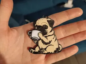 A pug drinking coffee keychain and magnet