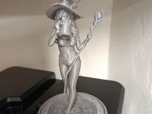 Beautiful witch drinking beer