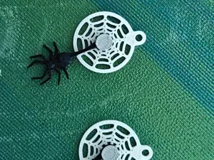 Spider Drop Earring — spider swings on a dragline