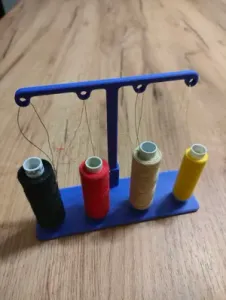 Thread guide for sewing machine for four spools