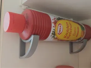 Curry ketchup bottle holder - mounts on shelf pegs