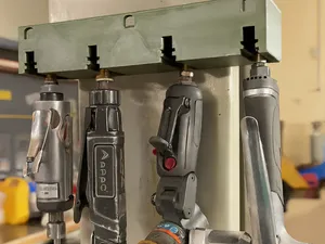 Pneumatic instrument wall holder with shelf