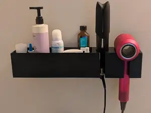 Hair dryer/straightener holder