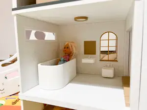 A bathtub for a dollhouse