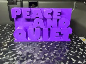 Peace and quiet joke desk ornament