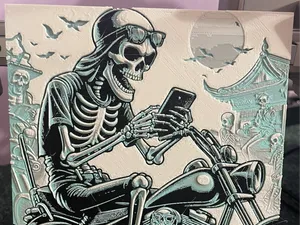 A Skeleton with Mobile on Motorcycle - A1 mini