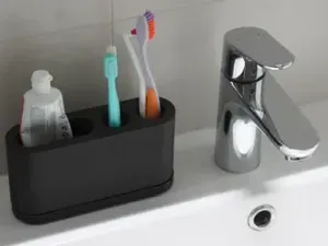 Holder for 2 toothbrushes and toothpaste