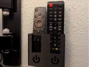 Samsung TV remote holder mounts to the wall.