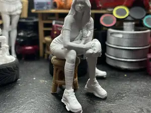 woman sitting on stool 