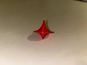 classic red plastic spinning top