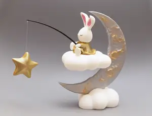 Cute figure of bunny sitting on the moon
