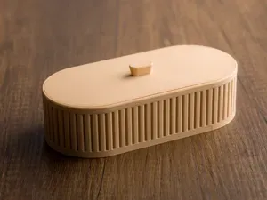 Low ribbed oval box with lid