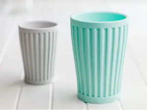 Ribbed toothbrush cup or pencils cup.