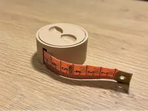 Packaging for a tailor's measuring tape