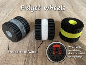 Fidget wheels with detents and free spin