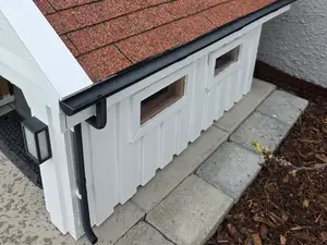 Gutter lawn mower garage