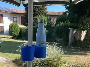 Cup and bottle holder for beach umbrella
