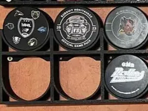 hockey puck stand on the wall