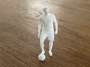 Kleiner Fußballer / Mann mit Fußball