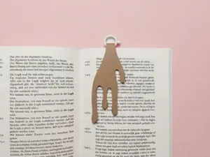 Spilled coffee cup laying bookmark