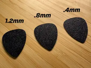 Guitar pics with varying thickness
