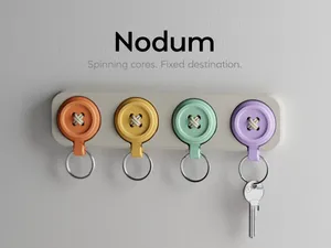 Nodum Keychain–Spinning cores. Fixed destination.