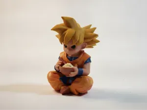 Son Goku Eating Dragon Ball Figurine