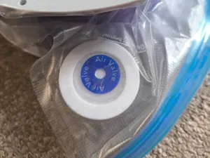 Slim valve helper for vacuum filament storage bags