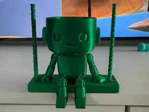 Stick figure on a swing - flower pot