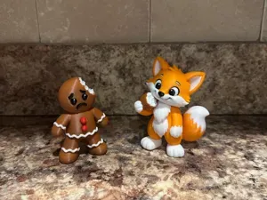 Fox taking a bite of the gingerbread man