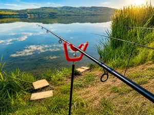 Fishing rod holder with bell.