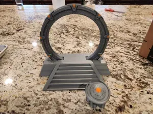 Stargate in an off-world pedestal with a DHD
