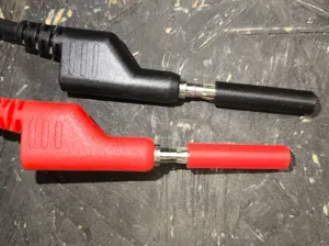 Banana plug cover isolation short prevention