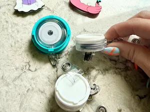 Interchangeable Badge Reel Topper System