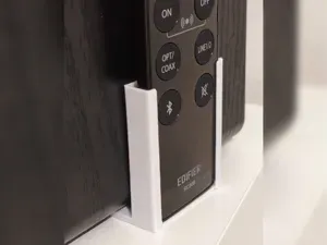 No-glue Edifier remote holder under-speaker