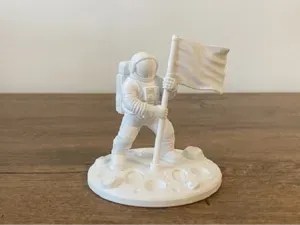 Astronaut Holding a Flag - Moon Landing Decoration