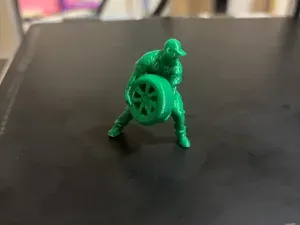 diorama miniature - man lifting tire