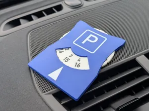 Parking disk with clicker dial