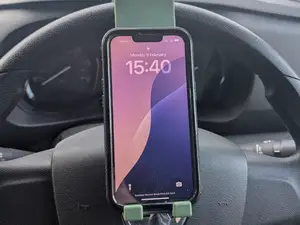 Phone holder for steering wheel.