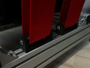 Racing simulator seatbelt guide roll