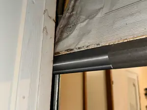 Old garage door sealer part