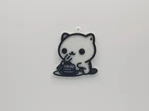 Cute Cat Eating a Cake Keychain