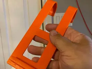 Steering wheel phone holder