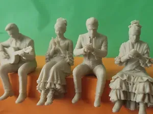 Flamenco sitting-on-the-ledge figures.
