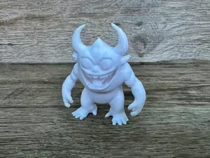 An Angry Monster With Horns and Teeth.