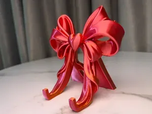 Elegant Bow Phone Stand – Heart Edition