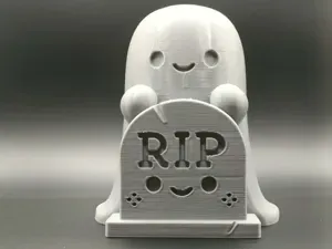 Cute Ghost Behind a RIP Tombstone