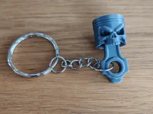 Piston Skull Keychain with Attitude